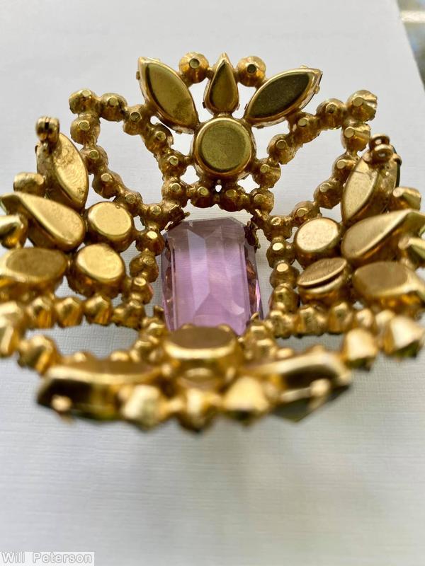 Schreiner rectangle shaped domed radial pin 4 small chaton formed circle at corner 5 large rectangle stone 12 surrounding navette large clear amethyst emerald cut center stone olivine inverted stone goldtone jewelry