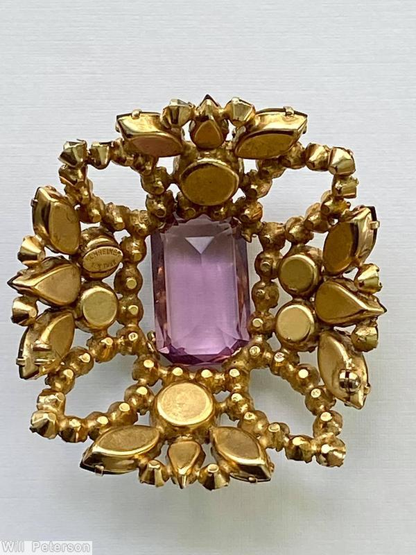 Schreiner rectangle shaped domed radial pin 4 small chaton formed circle at corner 5 large rectangle stone 12 surrounding navette large clear amethyst emerald cut center stone olivine inverted stone goldtone jewelry