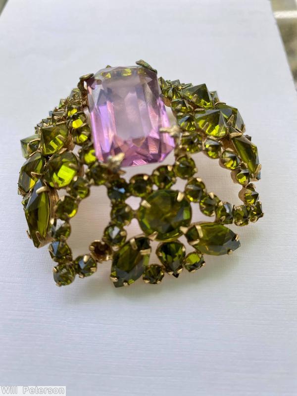 Schreiner rectangle shaped domed radial pin 4 small chaton formed circle at corner 5 large rectangle stone 12 surrounding navette large clear amethyst emerald cut center stone olivine inverted stone goldtone jewelry