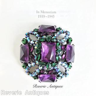 Schreiner rectangle shaped domed radial pin 4 small chaton formed circle at corner 5 large rectangle stone 12 surrounding navette purple rectangle large faceted stone emerald small faceted navette ab small chaton purple small faceted navette jewelry