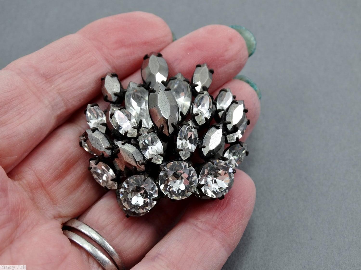Schreiner side radial 2 level pin 3 chaton varied size navette crystal metalic silver navette jewelry