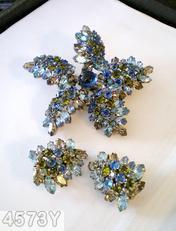 Schreiner star shaped radical pin round cab center 5 surrounding bush like branch on stem small navette small chaton royal blue round cab center ice blue navette peridot small chaton smoky navette silvertone jewelry