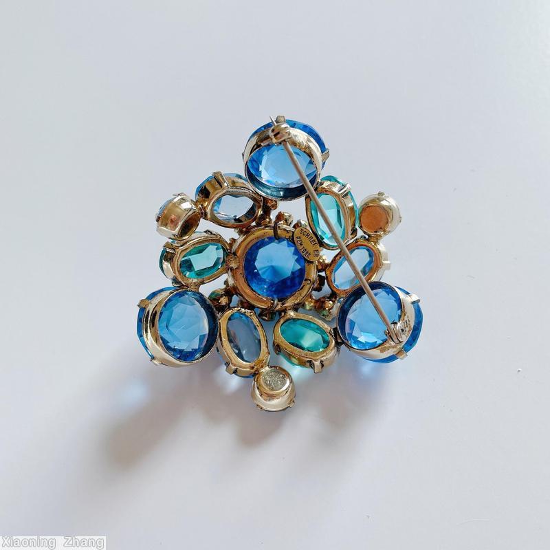 Schreiner swirled domed double triangle pin 6 large surrounding stone 5 floral branch pin faceted teardrop blue clear faceted large center aqua clear stone ice blue stone jewelry