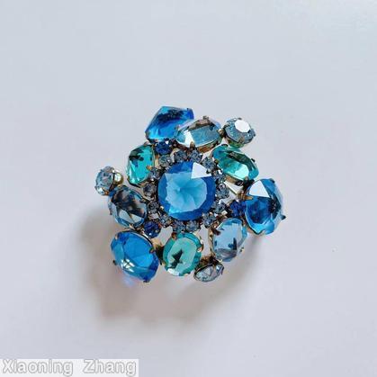 Schreiner swirled domed double triangle pin 6 large surrounding stone 5 floral branch pin faceted teardrop blue clear faceted large center aqua clear stone ice blue stone jewelry