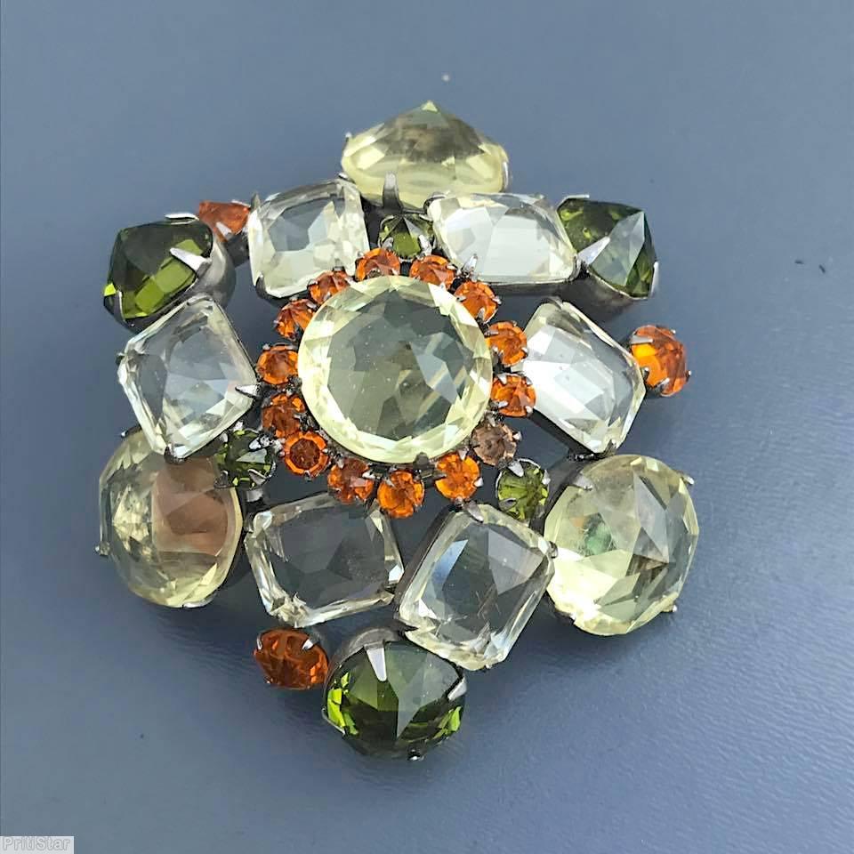 Schreiner swirled domed double triangle pin 6 large surrounding stone 5 floral branch pin faceted teardrop clear champagne coral large faceted crystal peridot jewelry