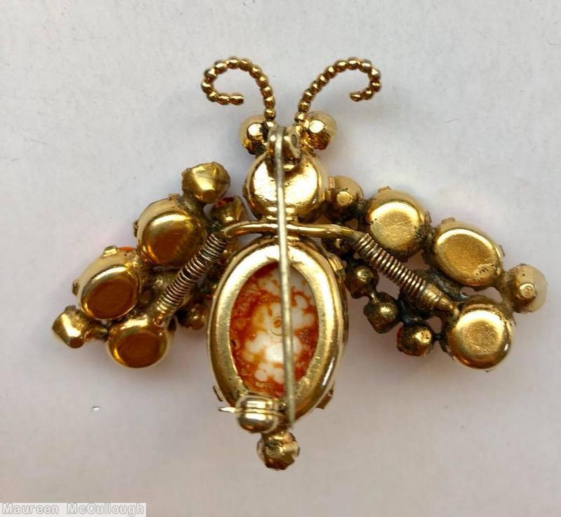 Schreiner trembling wing bug 3 chaton wing oval cab body coral champagne topaz peridot marbled white oval cab body goldtone jewelry