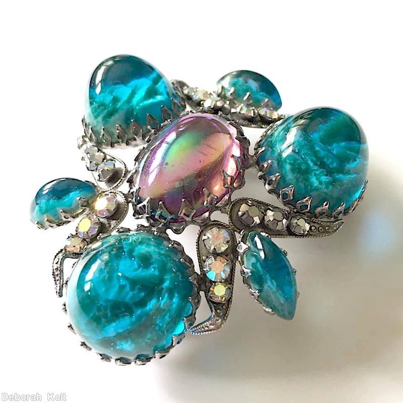 Schreiner triangle radial pin 3 large round cab 6 leaf shaped metal with varied size chaton embedded large oval cab center 3 navette marbled aqua round large cab ab pink large oval center crystal chaton silvertone jewelry