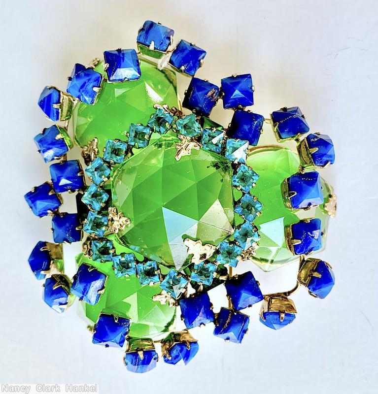 Schreiner triangle shaped 2 level radial pin 4 large hexgon rose cut stone 18 small surrouding square faceted inverted stone 3 sprawling branch small faceted square stone green large hexagon rose cut stone lapis small faceted squre stone aqua clear inverted square stone goldtone jewelry