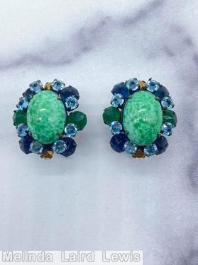 Schreiner 1 large oval cab center 16 surrounding small stone large oval peking glass center emerald chaton inverted small ice blue navy metalic brown chaton jewelry