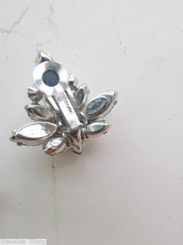 Schreiner 2 level asymmetric radial earring 1 large navette center top 3 navette 2 chaton bottom 3 large navette 3 small navette 2 chaton clear green large faceted navette crystal silvertone jewelry