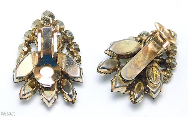 Schreiner 2 level leaf shape earring top level arch of 11 stone bottome level 3 large navette 2 navette olivine emerald goldtone jewelry