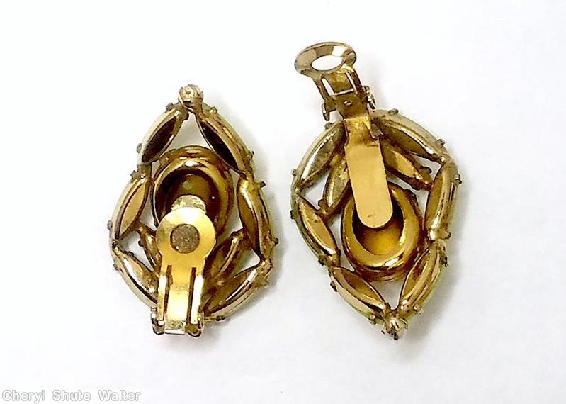 Schreiner domed large oval cab surrounded by 8 slim navette 3 faux pearl opaque celery navette faux pearl marbled large oval cab goldtone jewelry