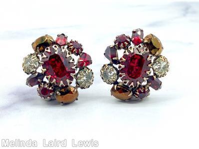 Schreiner domed radial earring large oval stone center 9 surrounding stone varied shape large ruby oval faceted stone brown metalic oval stone ruby teardrop crytal chaton goldtone jewelry