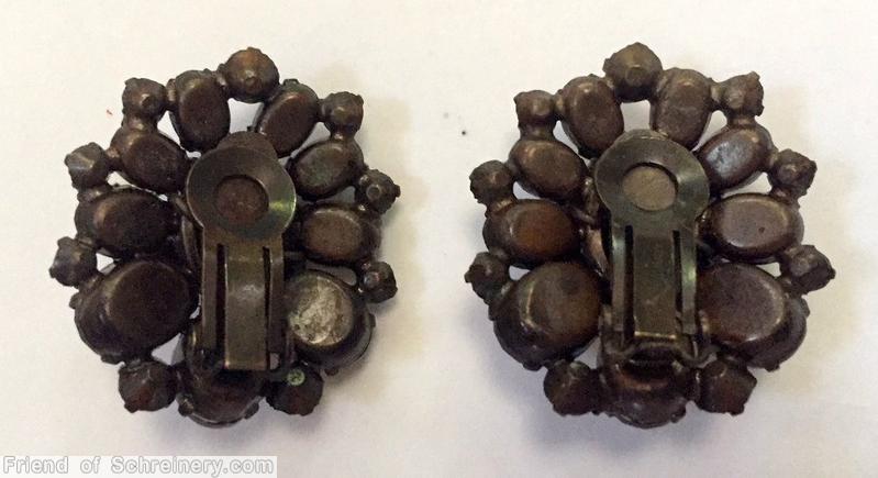 Schreiner domed radial oval shaped earring oval cab center 3 rounds 10 surrounding small chaton middle round 9 oval cab 9 small chaton outside copper back smoke amber jewelry