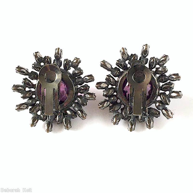 Schreiner large round cab center radial earring 18 surrounding stone of small navette chaton 12 outside small navette purple large faceted rose cut round cab peridot small navette ice pink small navette fuschia small chaton silvertone jewelry