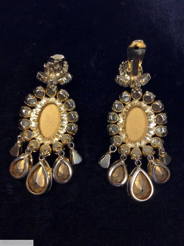 Schreiner top down danglinge earrings top 1 large oval stone 2 small navette 1 small chaton bottom 1 large oval center 14 surrounding small chaton 5 varied size dangline teardrop crystal goldtone jewelry