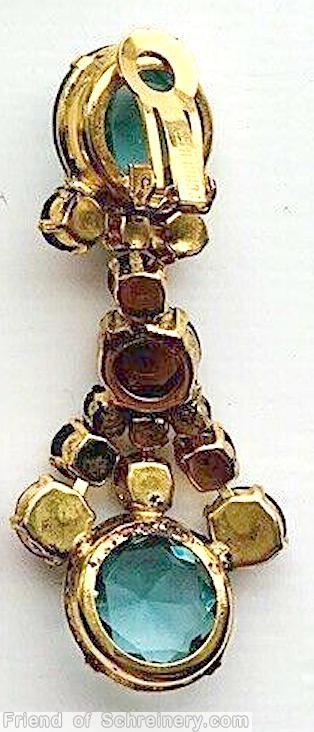 Schreiner top down long dangling earring top 1 large faceted chaton 3 sided small stone bottom 1 large faceted chaton 3 sided small stone middle 1 faceted chaton 4 surrounding stone ice aqua large faceted chaton brown inverted small chaton goldtone jewelry