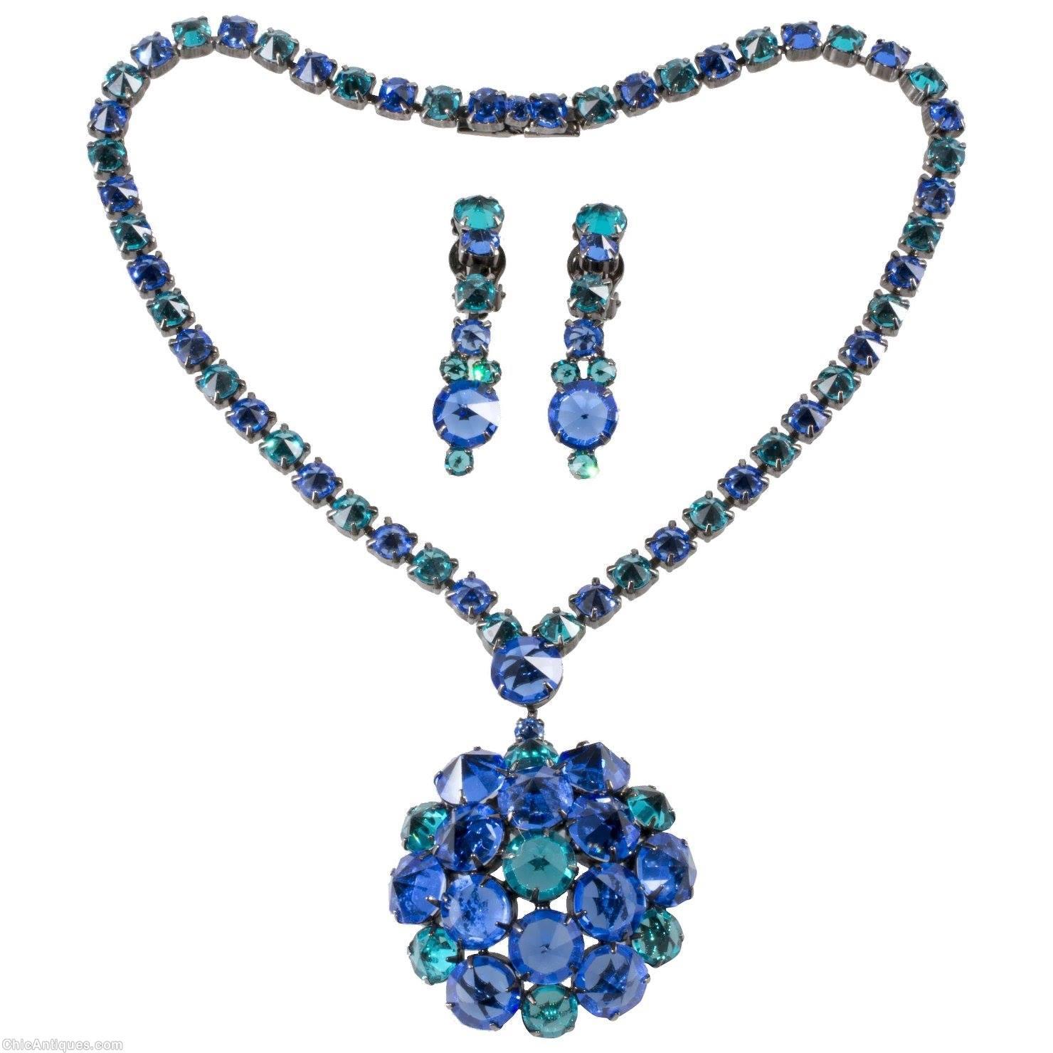 Schreiner highly domed radial pin 19 inverted stone 6 surrounding invertd 1 inverted large round stone single strand of small square stone clear navy aqua all inverted silvertone jewelry