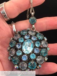 Schreiner double sided oval ball pendant large oval center 3 rounds each side ice blue large oval faceted cab smoke aqua ab chaton jewelry