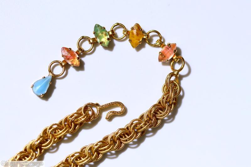 Schreiner square shaped pin 4 large oval cab border large oval cab center 13 surrounding faux pearl 4 group of 3 navette at corner all venetian stone in yellow coral green aqua moonglow small surrounding chaton goldtone jewelry