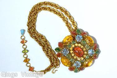 Schreiner square shaped pin 4 large oval cab border large oval cab center 13 surrounding faux pearl 4 group of 3 navette at corner all venetian stone in yellow coral green aqua moonglow small surrounding chaton goldtone jewelry