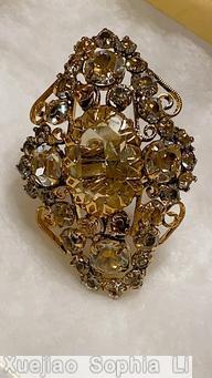 Schreiner diamond shaped ring large oval center stone 4 large chaton scrollwork champagne faceted large oval stone smoky goldtone jewelry