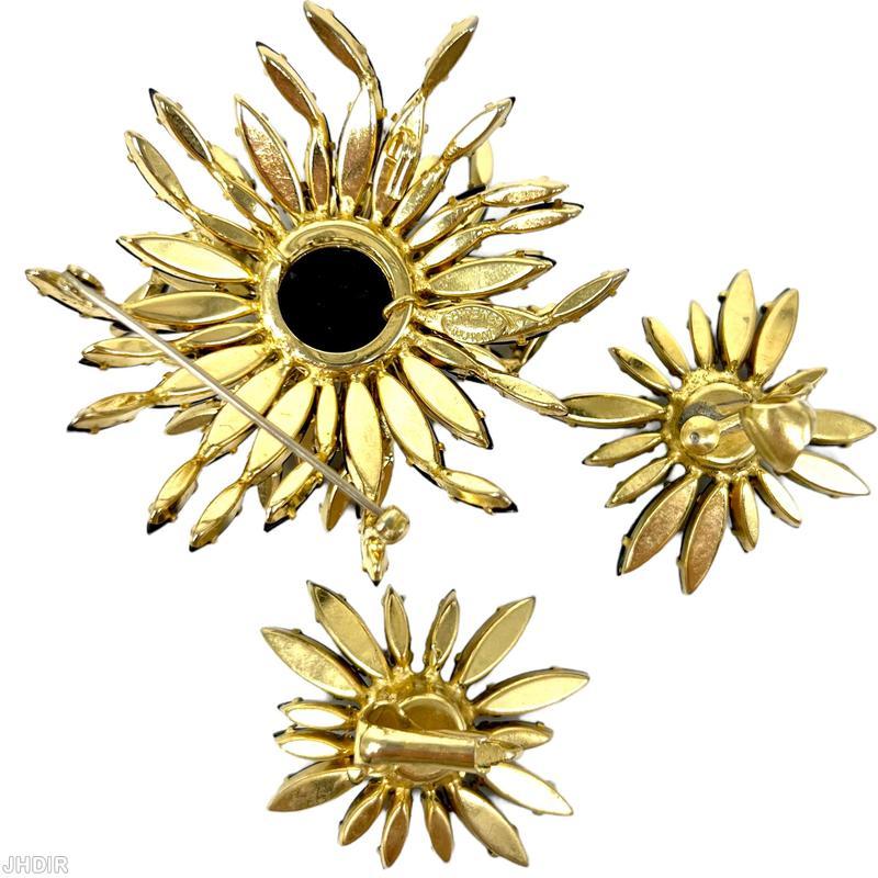Schreiner 2 level navette random arranged radial mums pin large round stone center jet goldtone jewelry