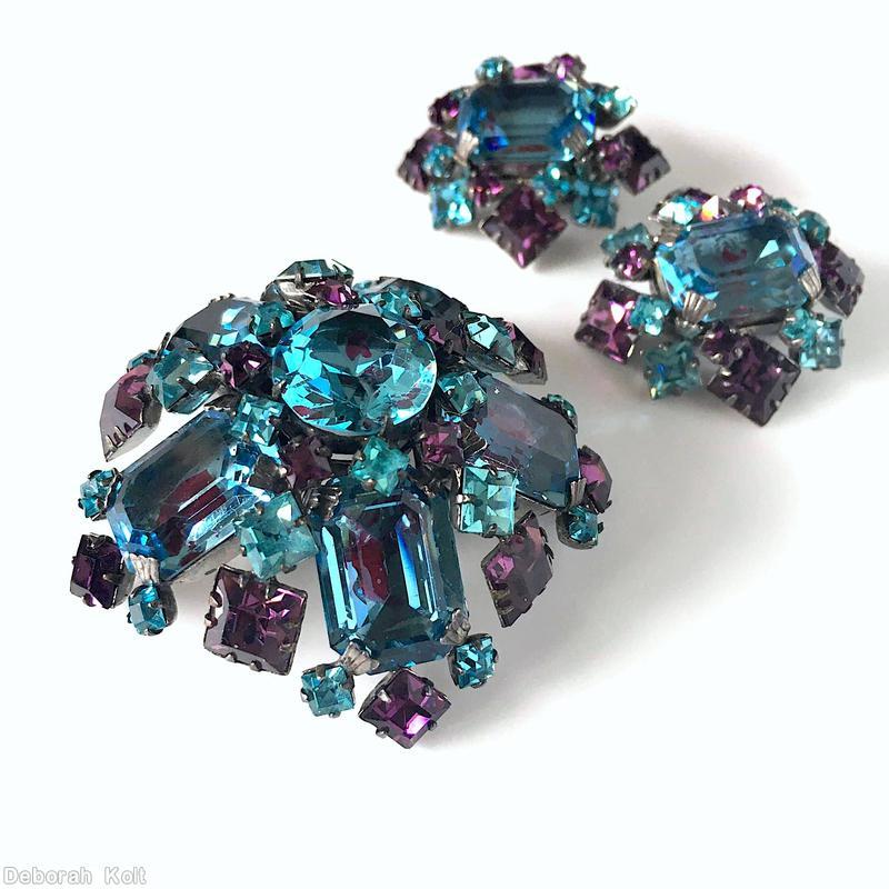 Schreiner 5 large emerald cut domed radial pin 10 surrounding small square stone clear aqua square stone purple faceted square bicolor large purple aqua emerald cut silvertone jewelry